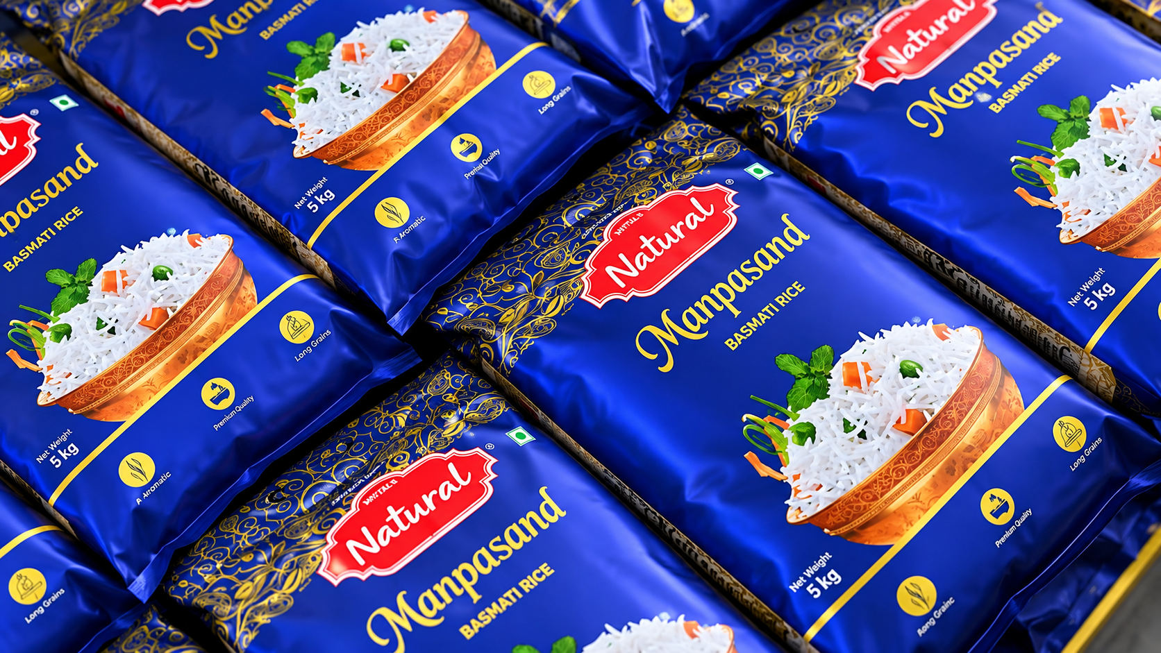 Rows of sealed Mittal's Natural Manpasand Basmati Rice 5 kg packs stacked after packing